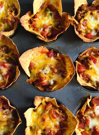 Cozy taco muffins topped with cheese and herbs, perfect for a savory snack