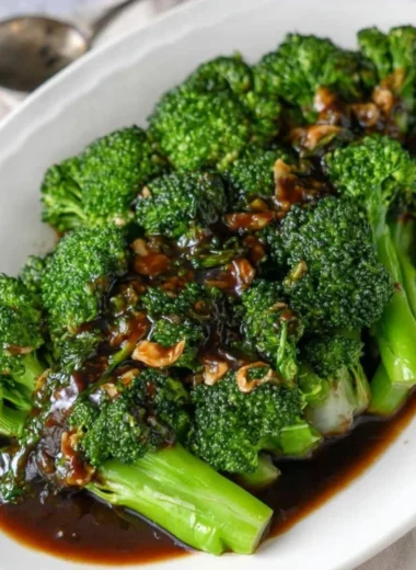 A vibrant dish of broccoli tossed in savory garlic sauce, easy to prepare.
