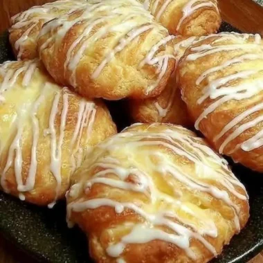 Freshly baked Individual Cream Cheese Danish pastry with creamy filling.