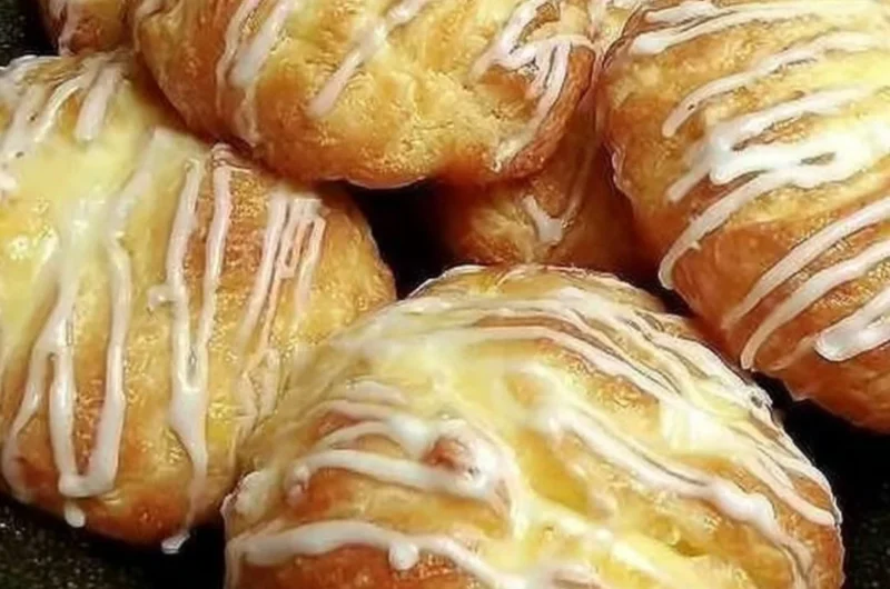 Freshly baked Individual Cream Cheese Danish pastry with creamy filling.