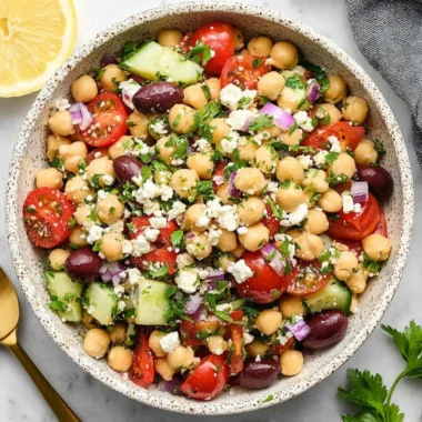 Delicious Mediterranean Chickpea Salad with fresh vegetables and herbs.
