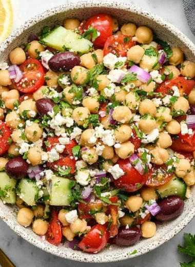 Delicious Mediterranean Chickpea Salad with fresh vegetables and herbs.