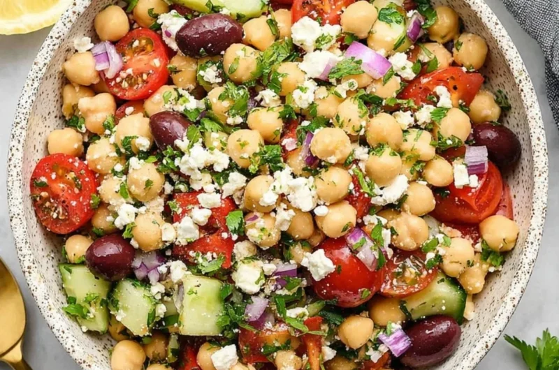 Delicious Mediterranean Chickpea Salad with fresh vegetables and herbs.