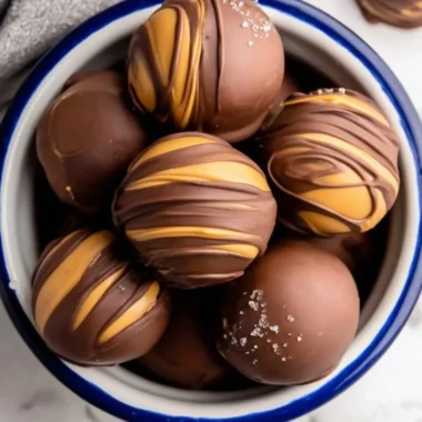 Delicious peanut butter chocolate fat bombs on a plate.