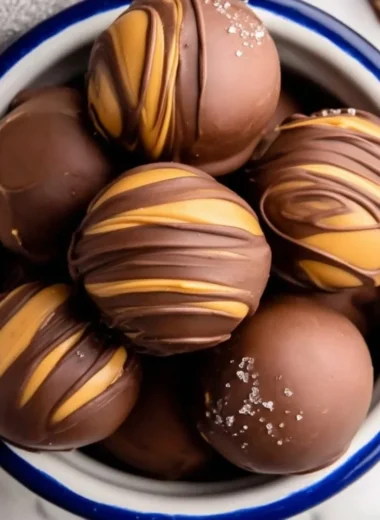 Delicious peanut butter chocolate fat bombs on a plate.