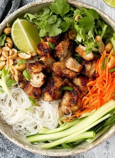 Vietnamese noodle bowl with lemongrass chicken served with fresh herbs and veggies